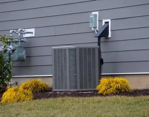 Residential air conditioning unit in the South Sound; Perfect Temp provides expert AC installation and seasonal maintenance to keep homes cool all summer.
