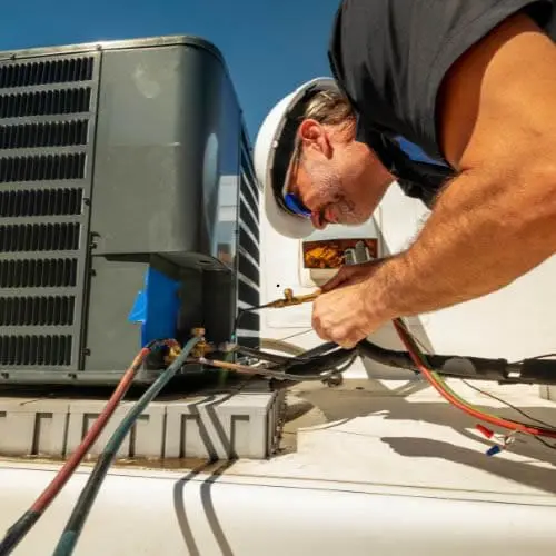Perfect Temp HVAC technician providing reliable heat pump repair services for a residential home in the Olympia South Sound area.