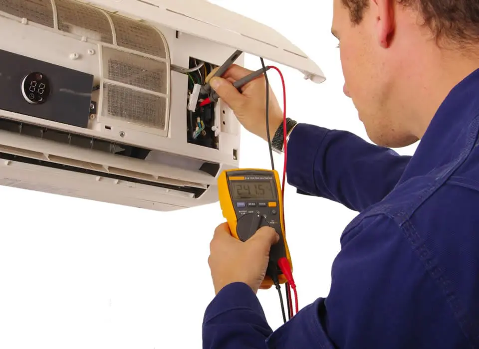 Expert ductless heating repair service featuring a certified technician troubleshooting a mini-split system in a residential home.