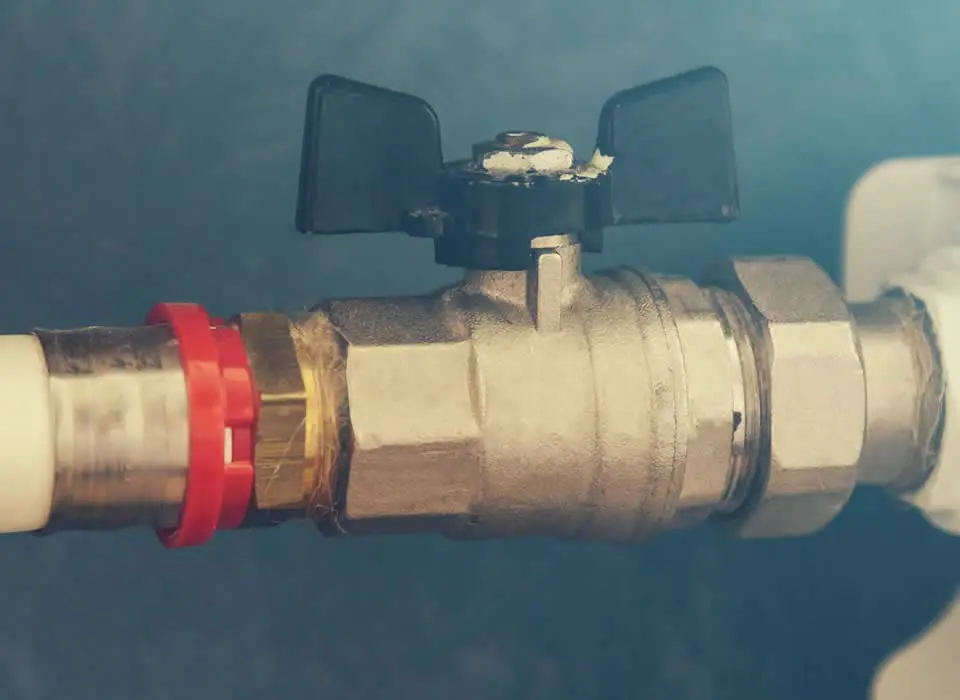 Emergency gas line repair and leak detection service showing a professional inspection of gas piping and shut-off valves.