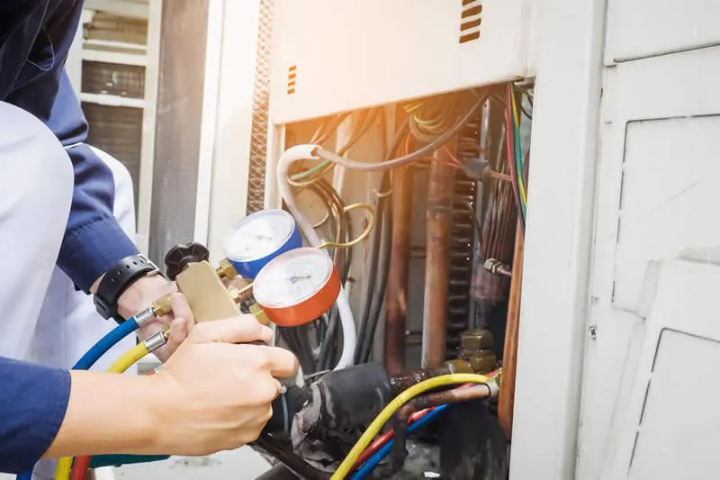 Perfect Temp HVAC Technician Working Air Conditioner in Olympia, WA